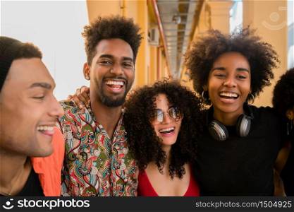 Portrait of Afro friends having fun in the city and spending good time together. Friendship and lifestyle concept.