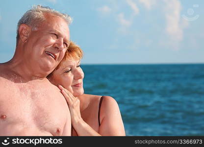 portrait of aged pair against sea