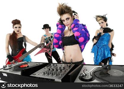 Portrait of all female punk rock band over white background