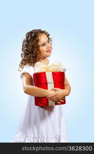 Portrait of an adorable preschool age girl wearing a Christmas holiday outfit