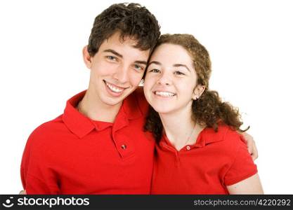 Portrait of an adorable teenaged couple isolated against a white background.