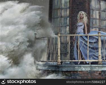 Portrait of an amazing lady standing on lighhouse during the storm
