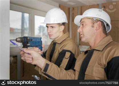 portrait of an apprentice drilling
