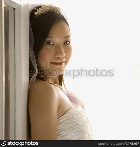 Portrait of an Asian bride looking at viewer.