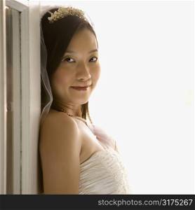 Portrait of an Asian bride looking at viewer.