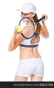 Portrait of an athlete looking back with a tennis racket on a white background