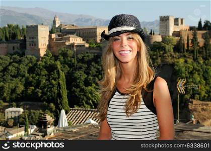 Portrait of an attractive smiling blonde woman with sun hat