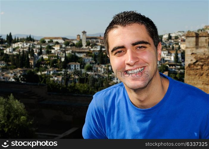 Portrait of an attractive smiling man in urban background