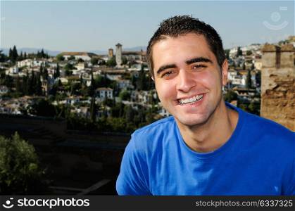 Portrait of an attractive smiling man in urban background