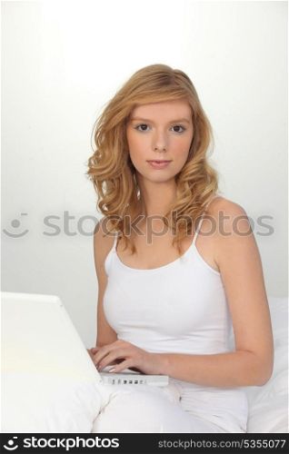 Portrait of an attractive young woman using her laptop