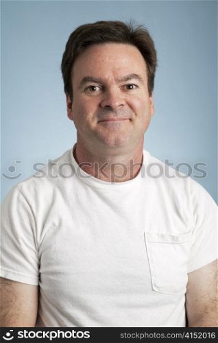Portrait of an average man in a blank white t-shirt.