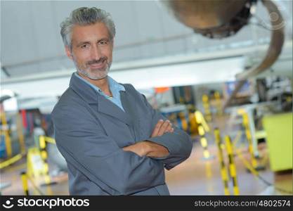 portrait of an aviation engineer in a hangar
