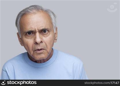 Portrait of an elderly angry man