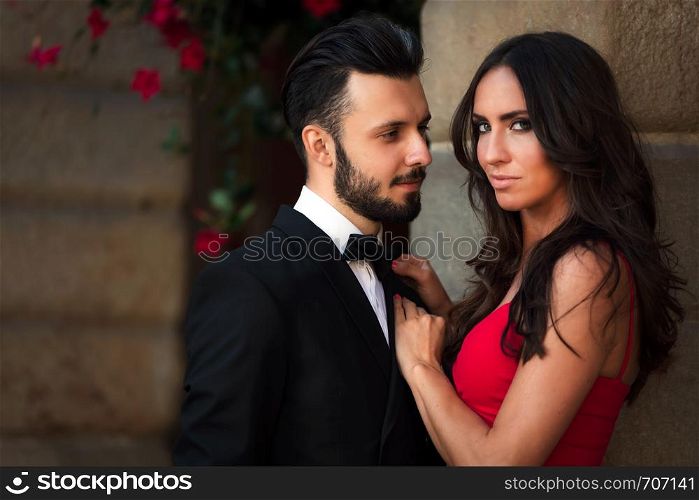 Portrait of an elegant fashion couple in love on a romantic date during a luxury banquet.