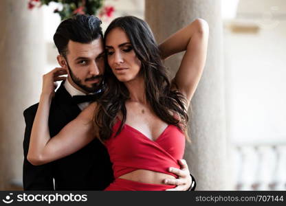 Portrait of an elegant fashion couple in love on a romantic date during a luxury banquet.