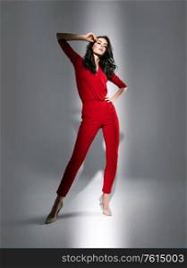 Portrait of an elegant woman wearing a red suit