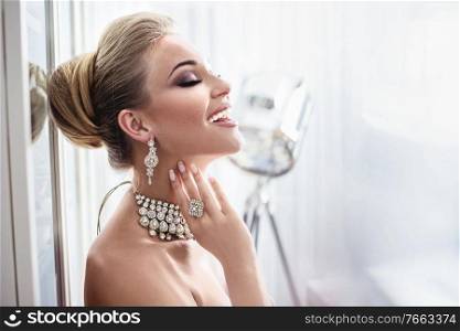 Portrait of an elegant woman wearing expensive jewelry
