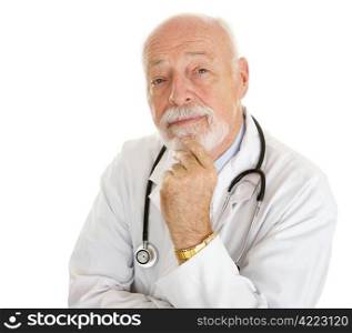 Portrait of an intelligent, thoughtful doctor isolated on white.
