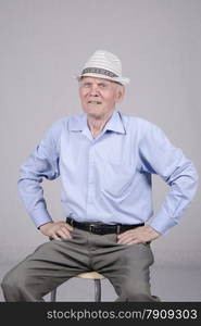 Portrait of an old man eighty years old. Studio light background