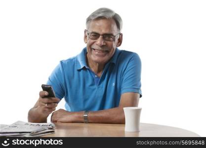 Portrait of an old man with a mobile phone