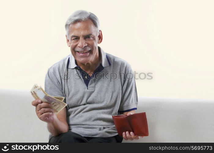 Portrait of an old man with money