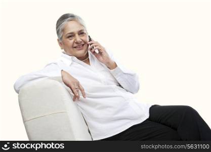 Portrait of an old woman talking on a mobile phone