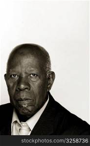 Portrait of an older African-American man in a suit.
