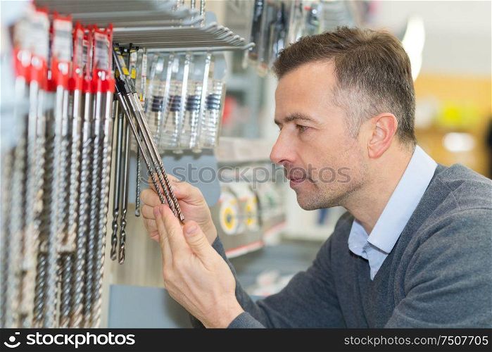 portrait of an ordinary man choosing tools