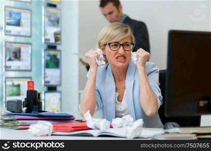 portrait of angry businesswoman screaming
