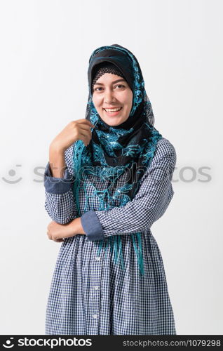 Portrait of Arabic muslim woman in colorful traditional clothes.