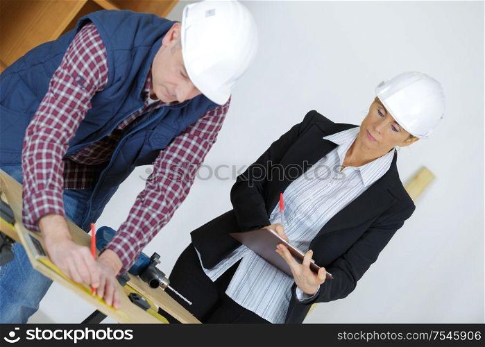 portrait of architect working with builder