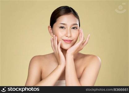 Portrait of ardent young woman with healthy clear skin and soft makeup looking at camera and posing beauty gesture. Cosmetology skincare and beauty concept.. Portrait of ardent young woman posing beauty gesture with clean fresh skin.