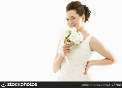 Portrait of Asian bride with bouquet.