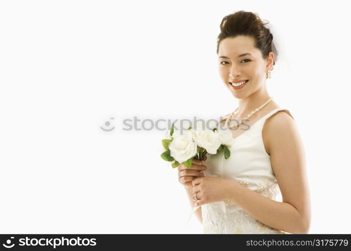 Portrait of Asian bride with bouquet.