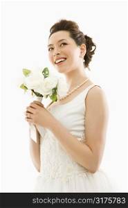 Portrait of Asian bride with bouquet.