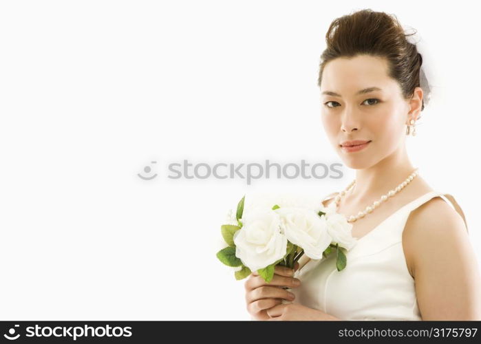 Portrait of Asian bride with bouquet.