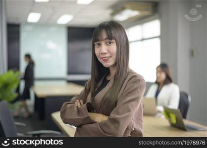 Portrait of Asian business woman is smiling in office