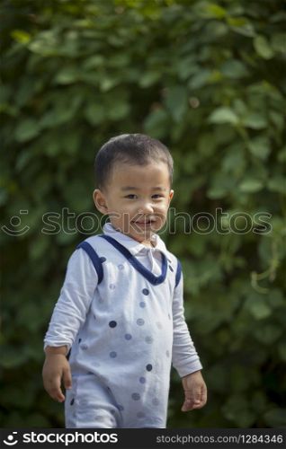 portrait of asian children happiness emotion toothy smiling face in garden
