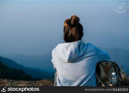 Portrait of Asian hiker woman with backpack relaxing on mountain and enjoying with copy space. Travel Lifestyle wanderlust adventure concept vacations outdoor.