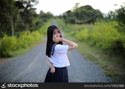 Portrait of asian japanese school girl costume looking at park outdoor