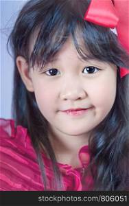 Portrait of asian little girl in red dress. portrait of asian little girl
