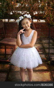 Portrait of asian little girl in white dress. Portrait of asian little girl