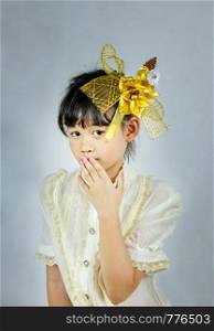 Portrait of asian little girl with golden flower. portrait of asian little girl