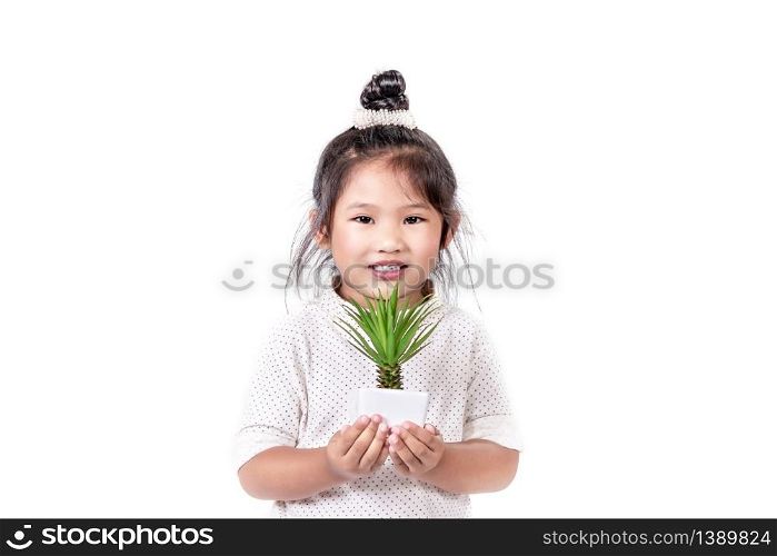 portrait of asian little girl with green plant over white background. portrait of asian little girl