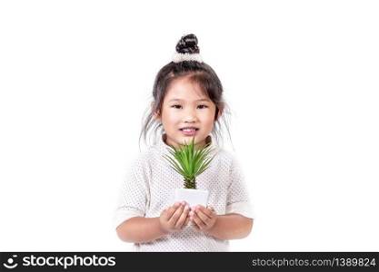 portrait of asian little girl with green plant over white background. portrait of asian little girl