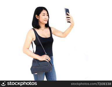 Portrait of Asian sexy woman using phone selfie on white background