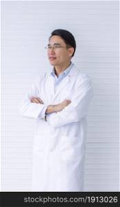 Portrait of Asian smart doctor wearing eyeglasses and standing. Education and Career concept.