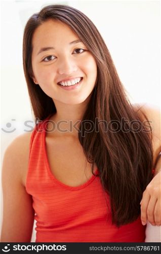 Portrait Of Asian Woman Relaxing Sitting On Sofa