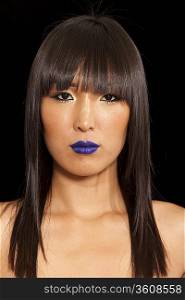 Portrait of Asian woman wearing blue lipstick