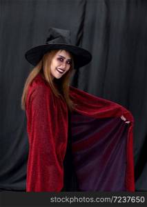 Portrait of asian young adult teenage woman wear Halloween costume cloth for Halloween party carnival. Halloween celebrate and international holiday concept.